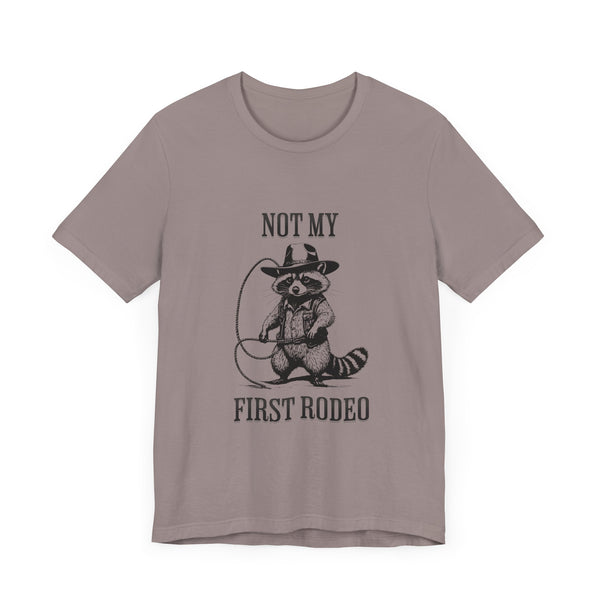 Not My First Rodeo Cowboy Raccoon Shirt, Funny Western Graphic Cotton Tee, Cute Quirky Country Style T-Shirt for Rodeo Fans & Animal Lovers
