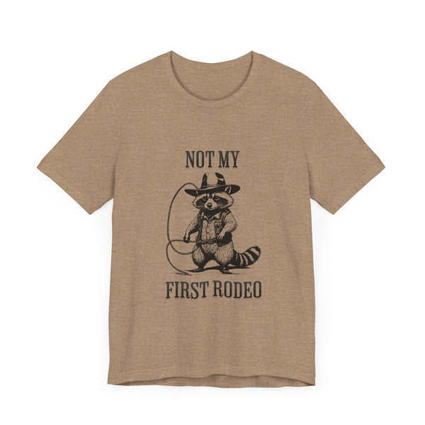 Not My First Rodeo Cowboy Raccoon Shirt, Funny Western Graphic Cotton Tee, Cute Quirky Country Style T-Shirt for Rodeo Fans & Animal Lovers