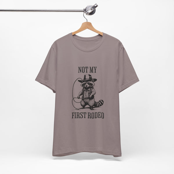 Not My First Rodeo Cowboy Raccoon Shirt, Funny Western Graphic Cotton Tee, Cute Quirky Country Style T-Shirt for Rodeo Fans & Animal Lovers