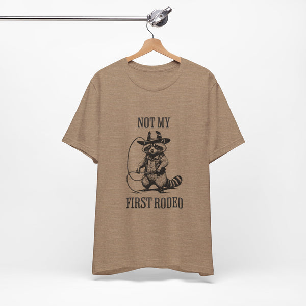 Not My First Rodeo Cowboy Raccoon Shirt, Funny Western Graphic Cotton Tee, Cute Quirky Country Style T-Shirt for Rodeo Fans & Animal Lovers