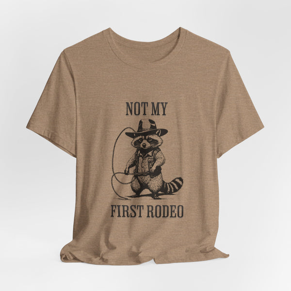 Not My First Rodeo Cowboy Raccoon Shirt, Funny Western Graphic Cotton Tee, Cute Quirky Country Style T-Shirt for Rodeo Fans & Animal Lovers