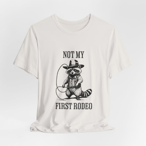 Not My First Rodeo Cowboy Raccoon Shirt, Funny Western Graphic Cotton Tee, Cute Quirky Country Style T-Shirt for Rodeo Fans & Animal Lovers