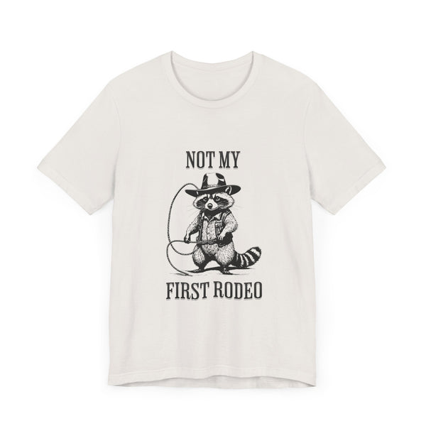 Not My First Rodeo Cowboy Raccoon Shirt, Funny Western Graphic Cotton Tee, Cute Quirky Country Style T-Shirt for Rodeo Fans & Animal Lovers