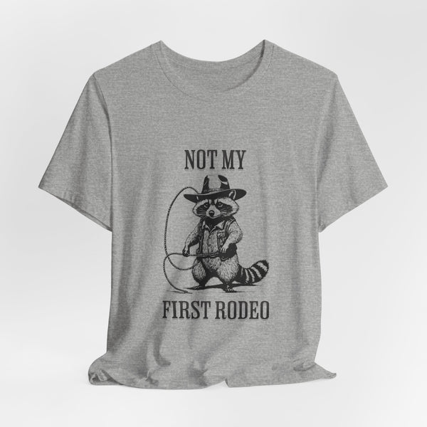 Not My First Rodeo Cowboy Raccoon Shirt, Funny Western Graphic Cotton Tee, Cute Quirky Country Style T-Shirt for Rodeo Fans & Animal Lovers