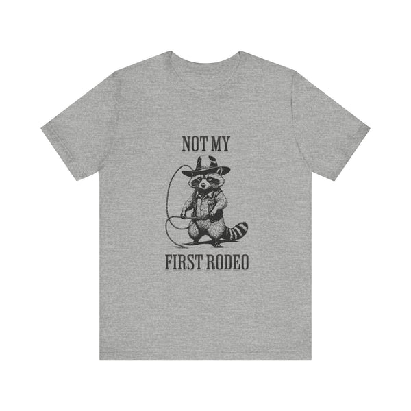 Not My First Rodeo Cowboy Raccoon Shirt, Funny Western Graphic Cotton Tee, Cute Quirky Country Style T-Shirt for Rodeo Fans & Animal Lovers