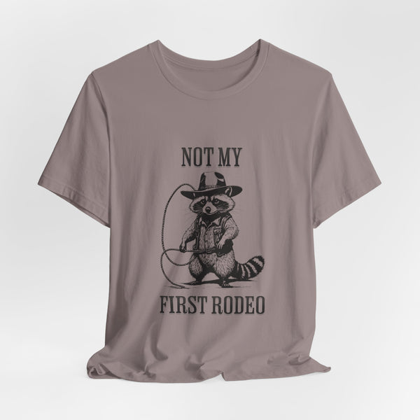 Not My First Rodeo Cowboy Raccoon Shirt, Funny Western Graphic Cotton Tee, Cute Quirky Country Style T-Shirt for Rodeo Fans & Animal Lovers